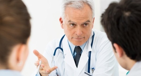 Doctor talking to a couple