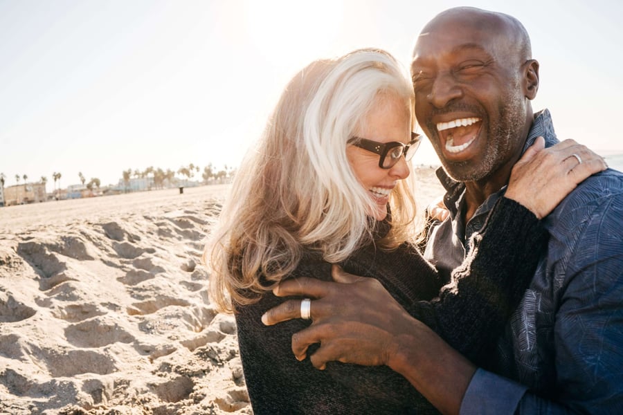 Couple laughing on the beach